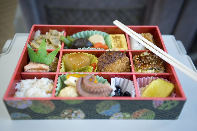 Traditional Japanese lunchbox containing variety of delicacies